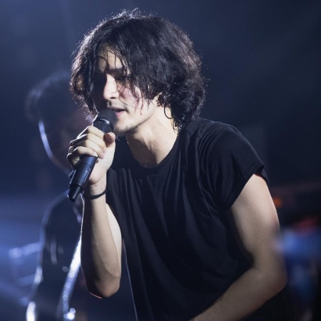 Violette Wautier's boyfriend Kao Jirayu during one of his musical concerts.